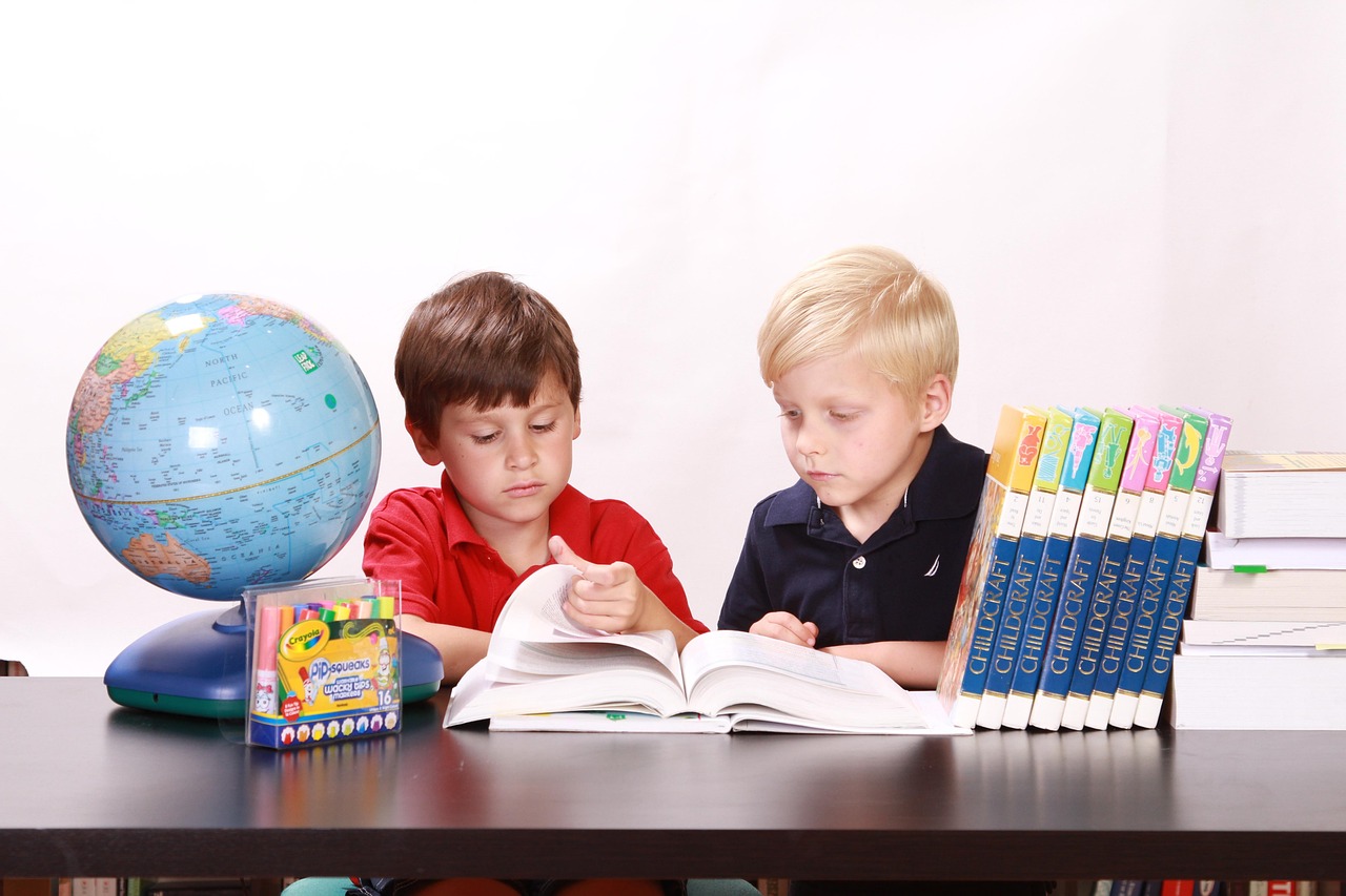 children, studying, togetherness, boys, reading, books, students, learning, educational, materials, globe, wooden, table, brown, desk, school, rooms, houses, homes, inside, indoors, interior, sitting, looking down, brothers, siblings, friends, friendship, childhood, innocent, innocence, young, people, two, person, little, small, kids, students, students, globe, school, school, school, school, school
